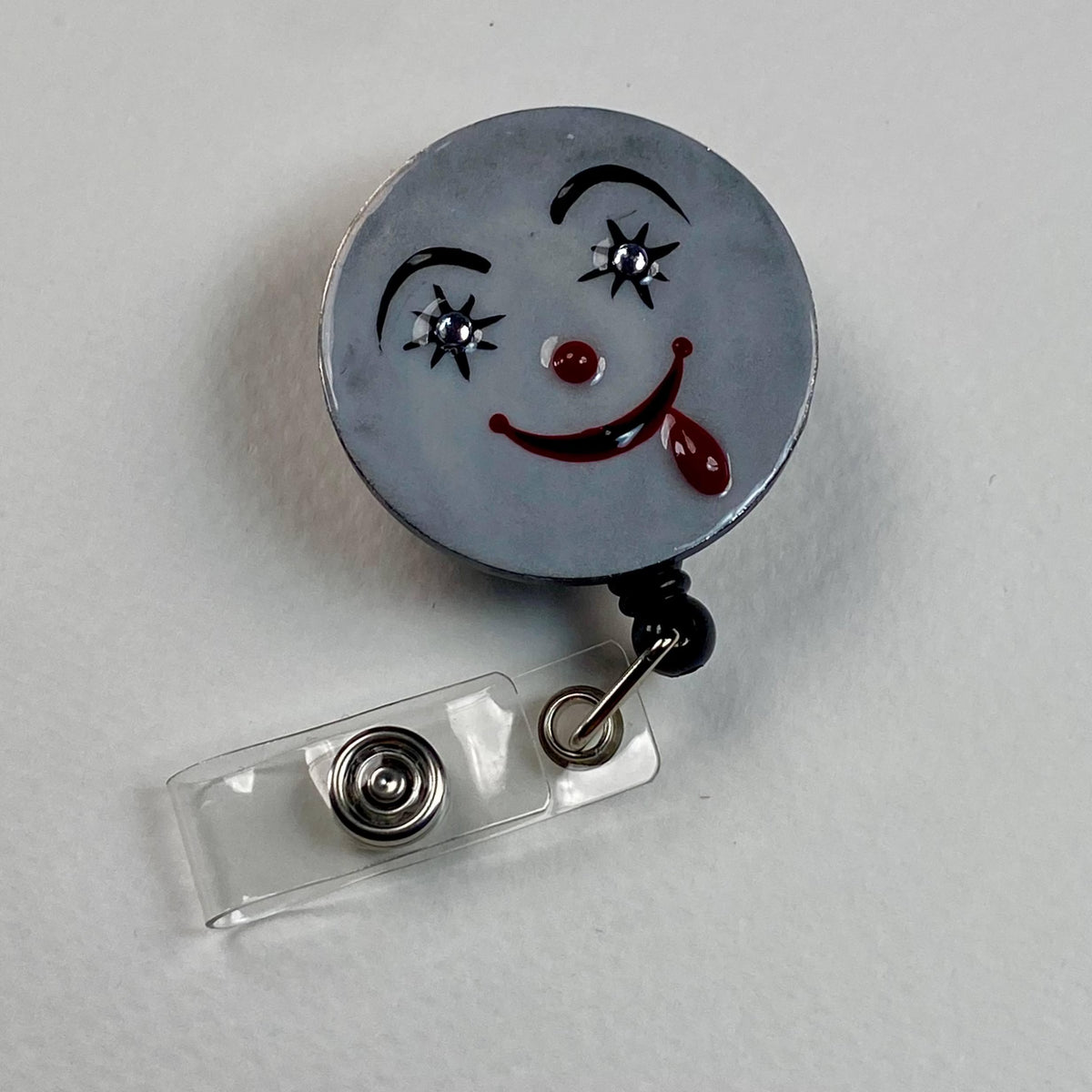 Creepy Smile Badge Reel – Handmade Horror Face Stainless Steel Retractable ID Holder, Spooky Cute Badge Reel for Nurses & Teachers